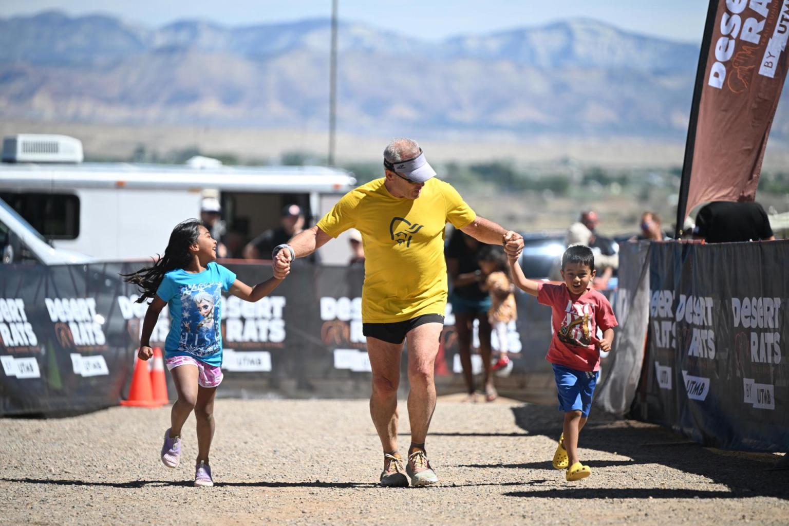 Chris and Grandkids crossing finish line