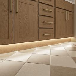 Bathroom toe-kick and wayfinder lighting installed under cabinets to illuminate the floor, ploviding subtly guidance and safety. 