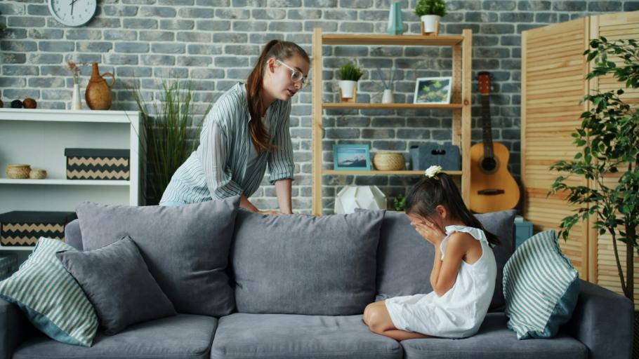 Child having a melt down with parent trying to talk